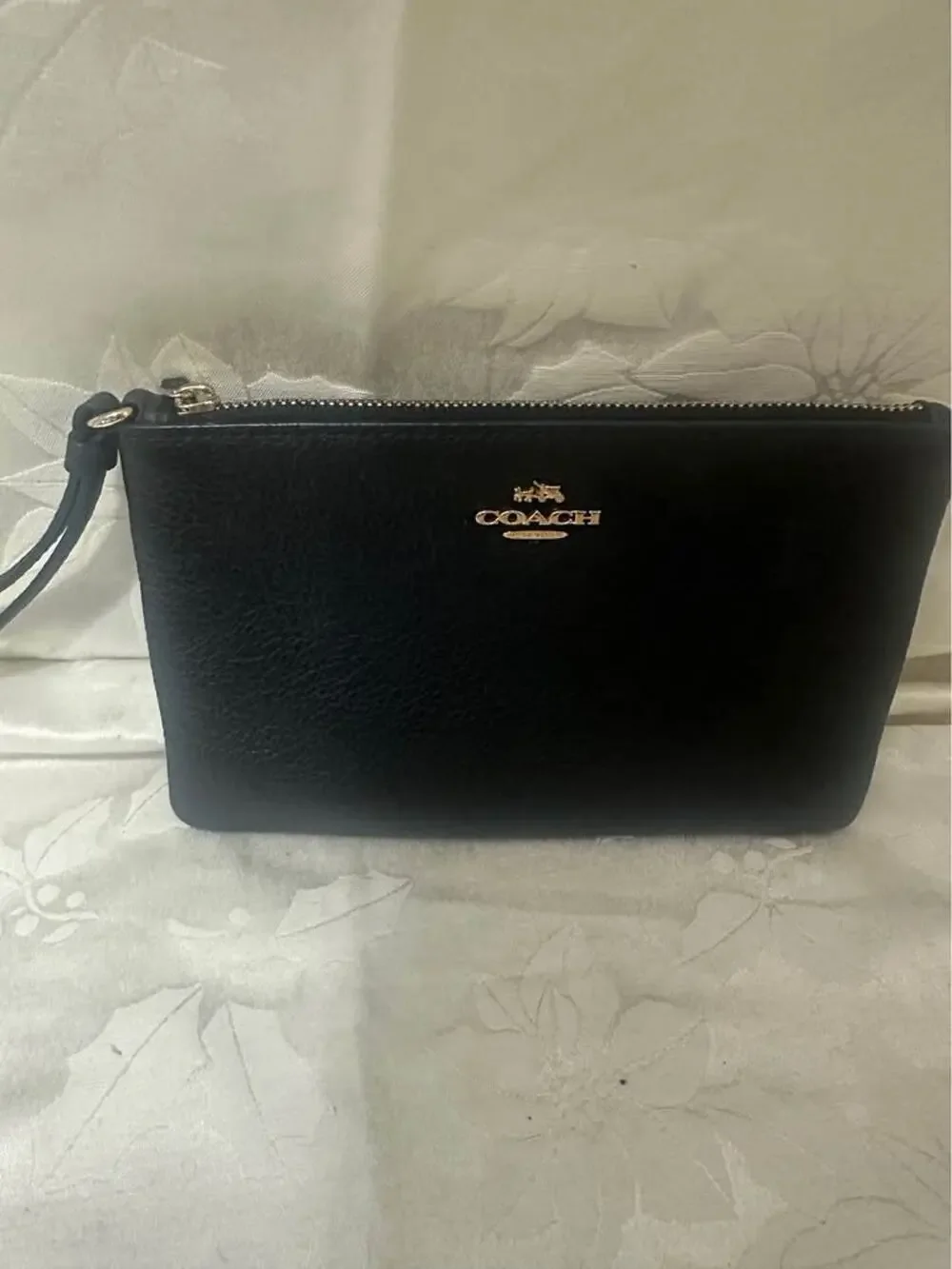 Pre-loved Coach Black Pebbled Leather Wristlet. B-303